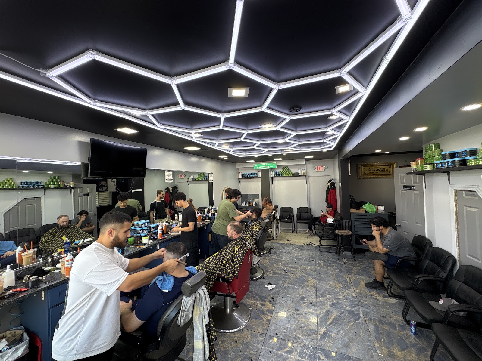 Shop floor, chairs at work under hexagonal LED lighting