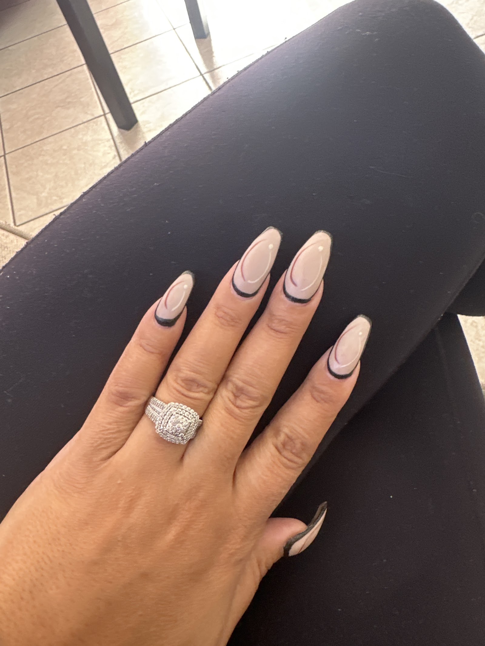 Sheer almond, black french edge