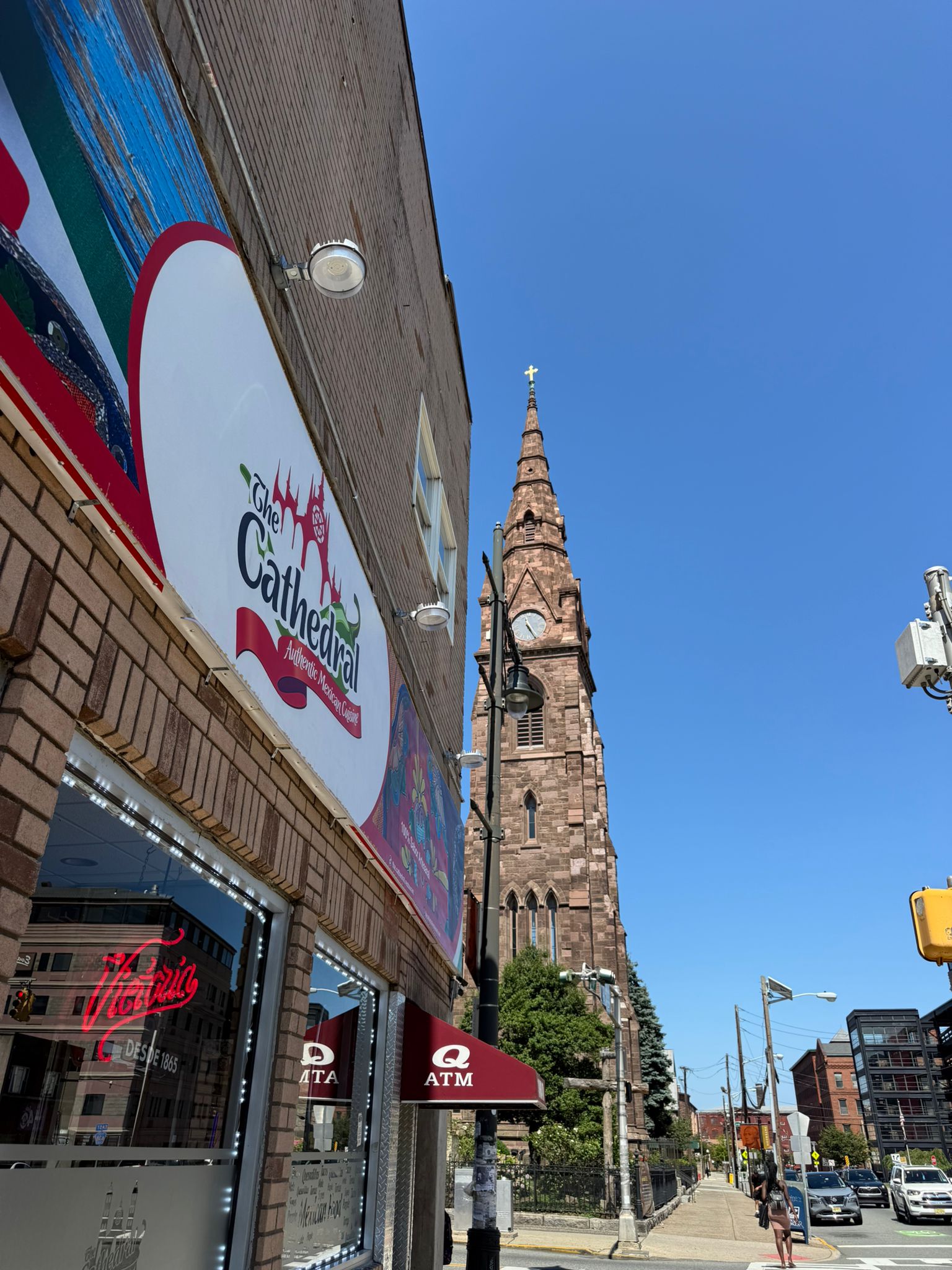 The Main Street cathedral spire beside the Cathedral Restaurant storefront